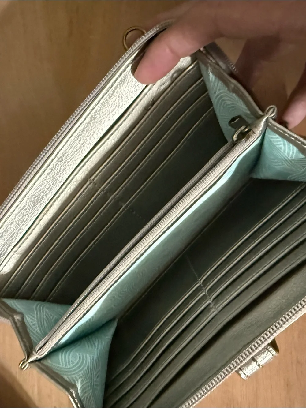 Metallic bronze ish.Not silver or gold but in between Women’s Wallet crossbody